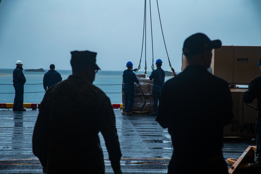 31st MEU Marines, USS America Sailors conduct supply onload at White Beach