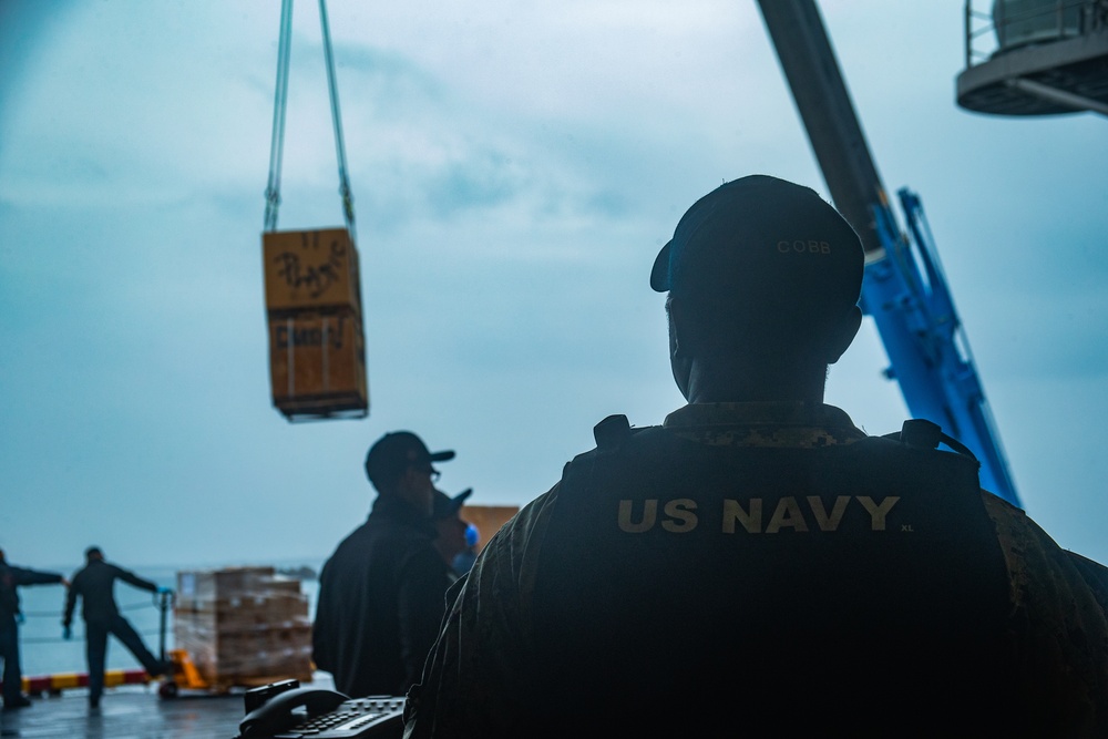 31st MEU Marines, USS America Sailors conduct supply onload at White Beach