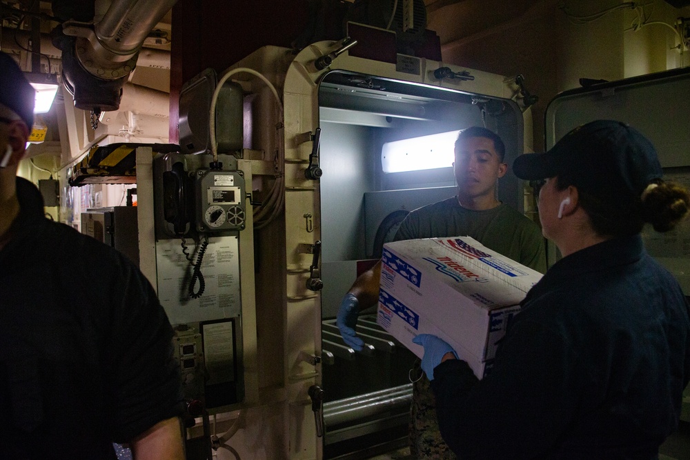 31st MEU Marines, USS America Sailors conduct supply onload at White Beach