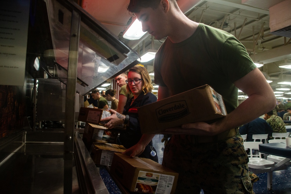 31st MEU Marines, USS America Sailors conduct supply onload at White Beach