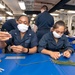Sailors help create masks to comply with new directives