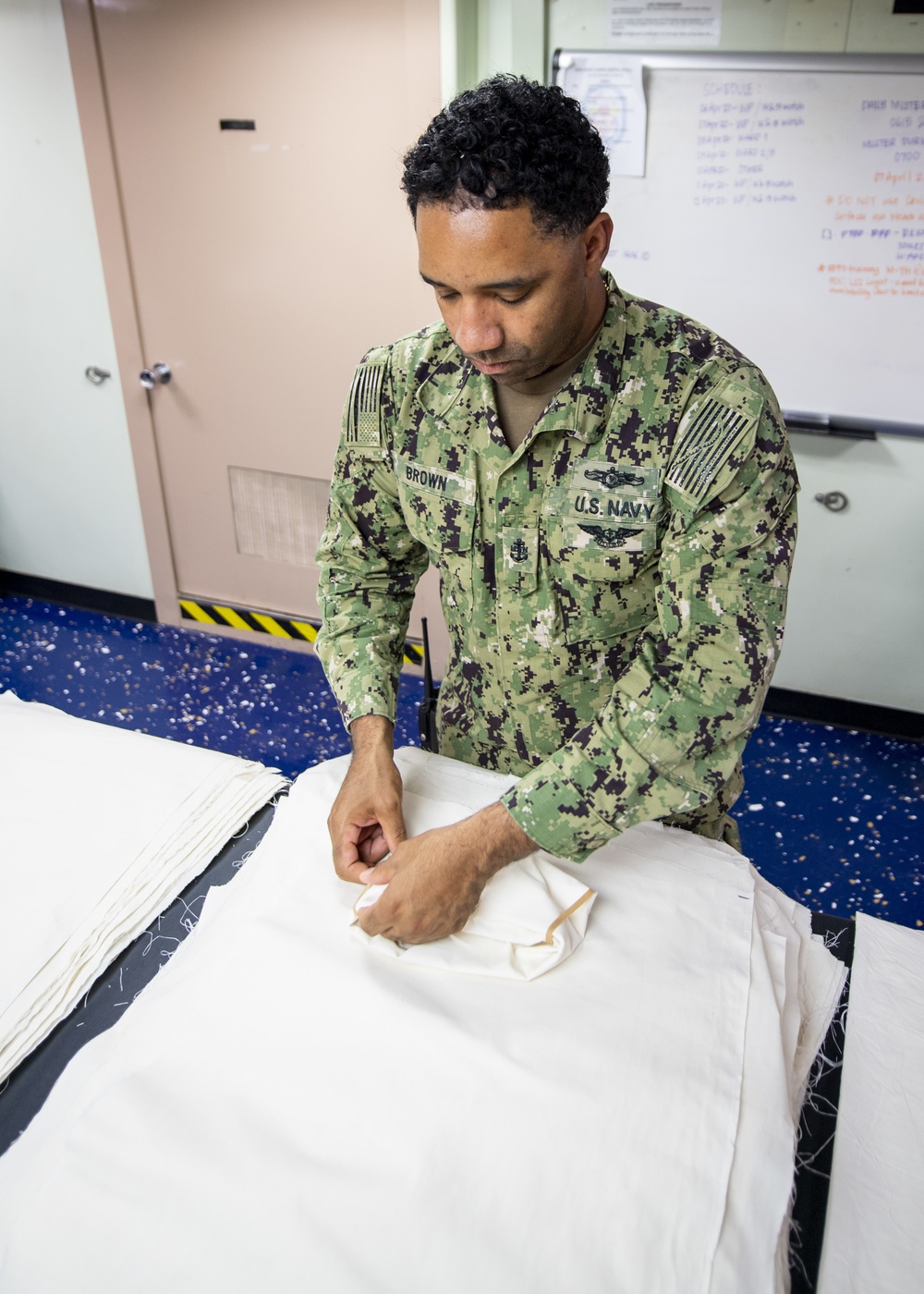 USNS Mercy Chief Prepares a Face Mask