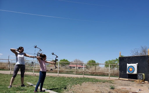 Master Sergeant Marci Montoya practices archery with family at home during Covid 19 Pandemic