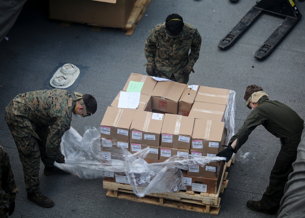 Marines participate in a replenishment-at-sea aboard the USS New York