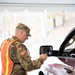 Teams of guardsmen conduct verbal and visual screenings of personnel entering bases across the Rhode Island National Guard