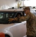 Teams of guardsmen conduct verbal and visual screenings of personnel entering bases across the Rhode Island National Guard