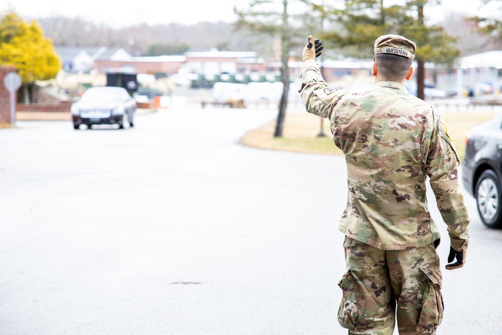 Teams of guardsmen conduct verbal and visual screenings of personnel entering bases across the Rhode Island National Guard
