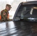Teams of guardsmen conduct verbal and visual screenings of personnel entering bases across the Rhode Island National Guard