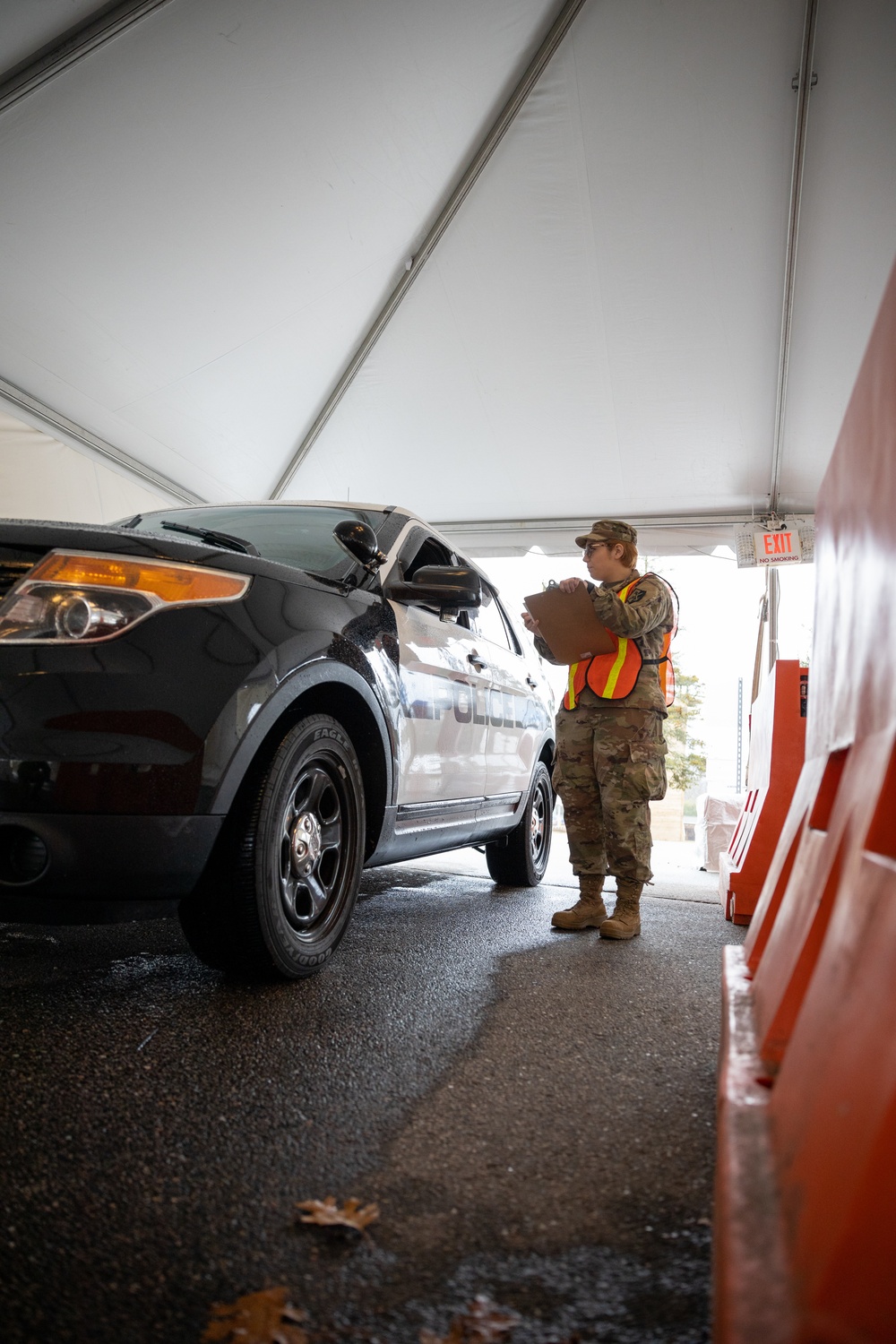 Teams of guardsmen conduct verbal and visual screenings of personnel entering bases across the Rhode Island National Guard