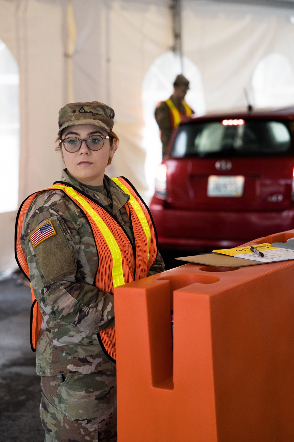 Teams of guardsmen conduct verbal and visual screenings of personnel entering bases across the Rhode Island National Guard