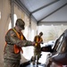 Teams of guardsmen conduct verbal and visual screenings of personnel entering bases across the Rhode Island National Guard