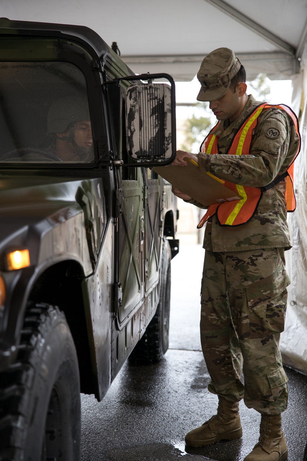 Teams of guardsmen conduct verbal and visual screenings of personnel entering bases across the Rhode Island National Guard