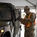 Teams of guardsmen conduct verbal and visual screenings of personnel entering bases across the Rhode Island National Guard