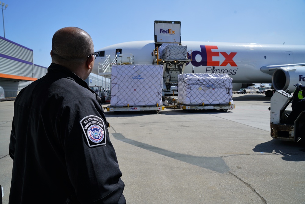 CBP Office of Field Operation Ofﬁcer Monitors the Delivery of Personal Protective Equipment