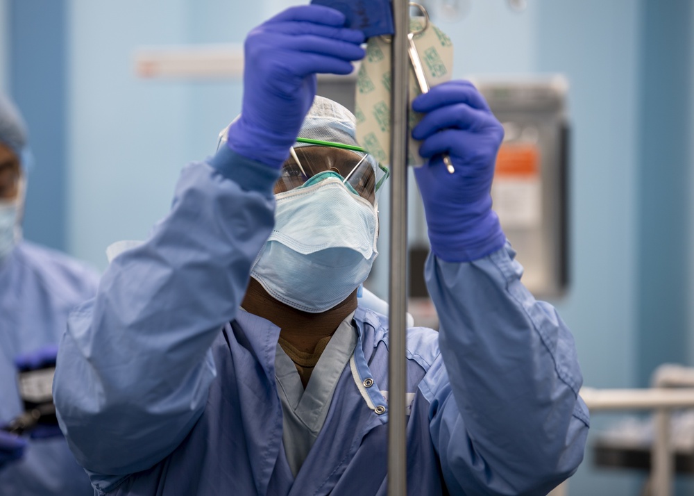 USNS Mercy Sailor Prepares an Operating Room