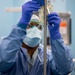 USNS Mercy Sailor Prepares an Operating Room