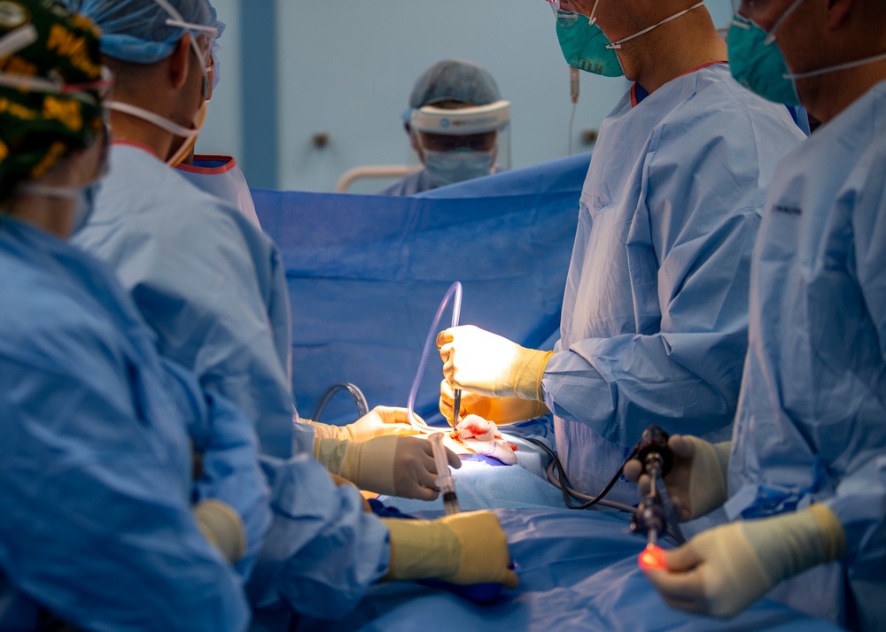 USNS Mercy Sailors Perform Surgery