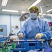 USNS Mercy Sailor Examines Tools