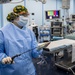 USNS Mercy Sailor Examines Tools