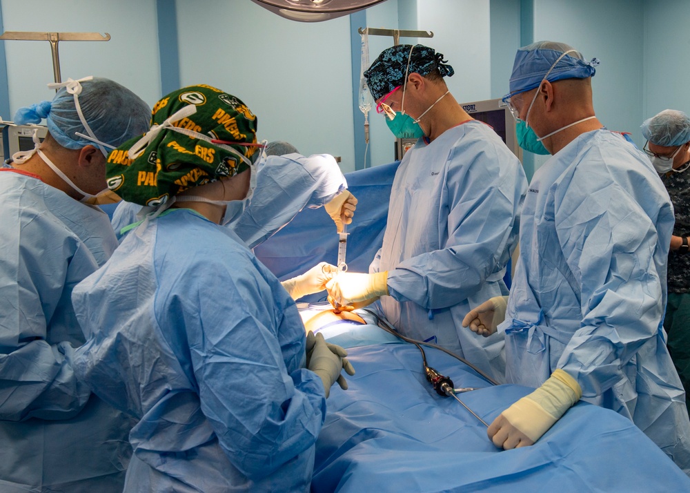 USNS Mercy Sailors Perform Surgery