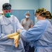 USNS Mercy Sailor Dons Surgical Gloves