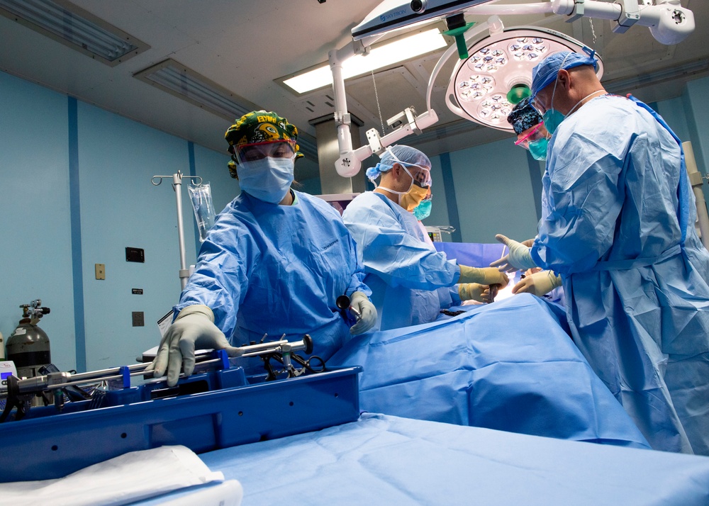 USNS Mercy Sailors Perform Surgery