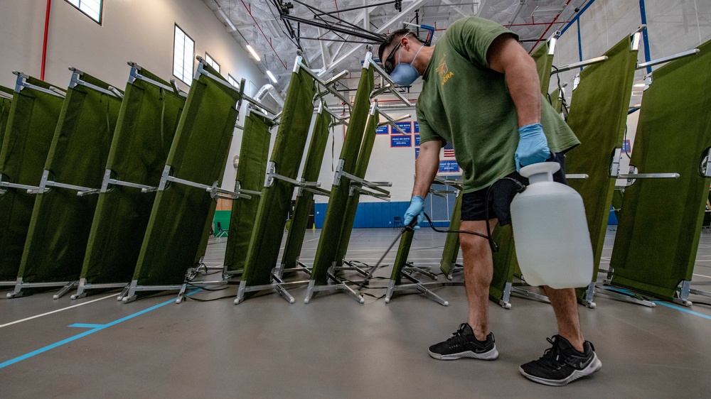 3rd Medical Battalion, 3rd Marine Logistics Group, sterilize a building in support of USS Theodore Roosevelt (CVN 71) Sailors