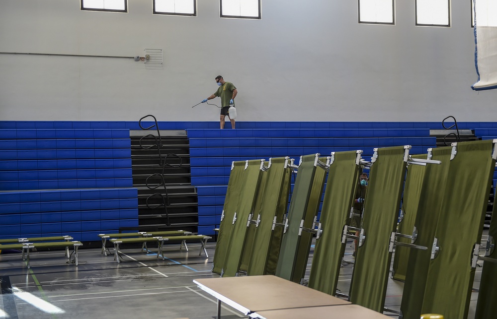 3rd Medical Battalion, 3rd Marine Logistics Group, sterilize a building in support of USS Theodore Roosevelt (CVN 71) Sailors