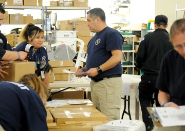 Volunteers and Military personnel work together to ship 500 ventilators to various states