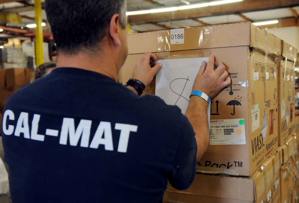Volunteers and Military personnel work together to ship 500 ventilators to various states