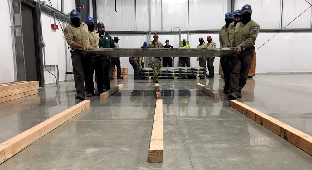 Volunteers and Military personnel work together to ship 500 ventilators to various states