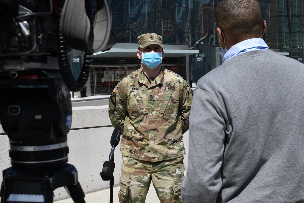 Media members speak to New York National Guard members