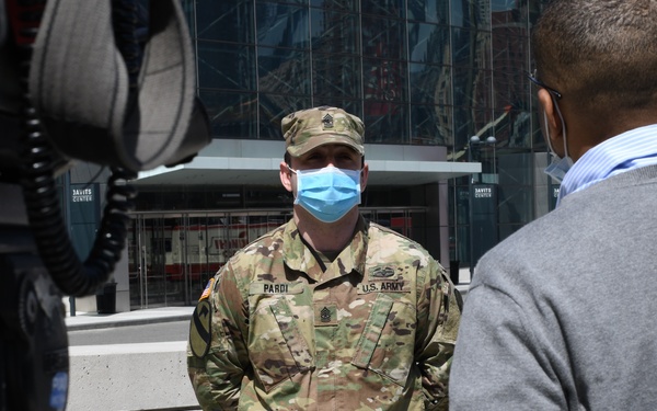 Media members speak to New York National Guard members
