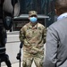 Media members speak to New York National Guard members