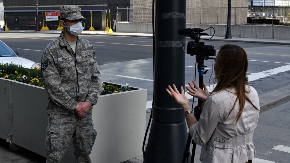 Media members speak to New York National Guard members
