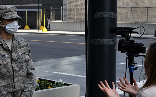 Media members speak to New York National Guard members