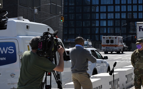 Media members speak to New York National Guard members