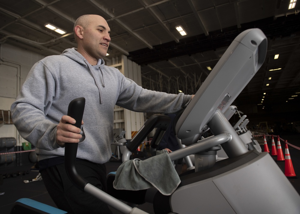 Sailor Exercises in Hangar Bay