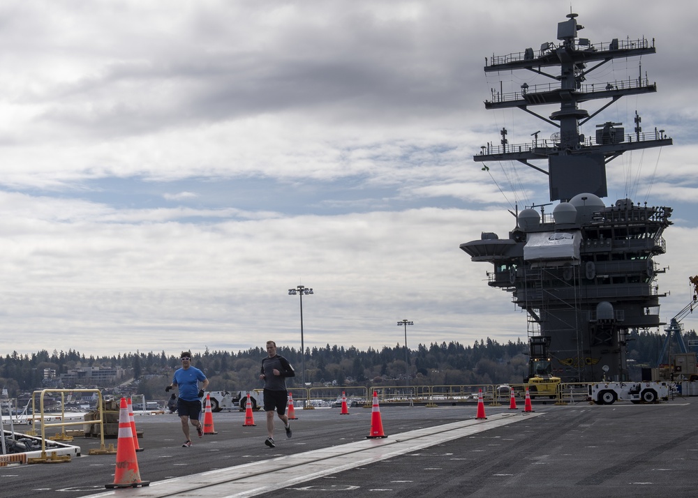 Nimitz Sailors Run On Flight Deck