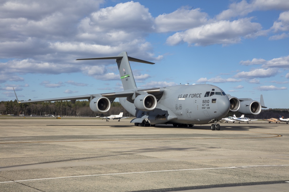 Members of The 801st Combat Support Hospital, U.S. Army Reserve, Fort Sheridan, Illinois, arrives in Hanscom Air Force Base, April 11, 2020, on a C-17 aircraft.