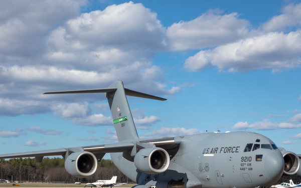 Members of The 801st Combat Support Hospital, U.S. Army Reserve, Fort Sheridan, Illinois, arrives in Hanscom Air Force Base, April 11, 2020, on a C-17 aircraft.