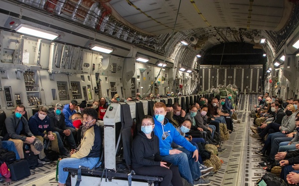 Members of The 801st Combat Support Hospital, U.S. Army Reserve, Fort Sheridan, Illinois, arrives in Hanscom Air Force Base, April 11, 2020.