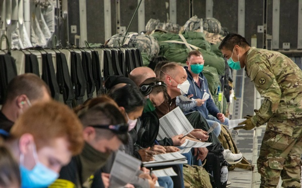 Members of The 801st Combat Support Hospital, U.S. Army Reserve, Fort Sheridan, Illinois, arrives in Hanscom Air Force Base, April 11, 2020.