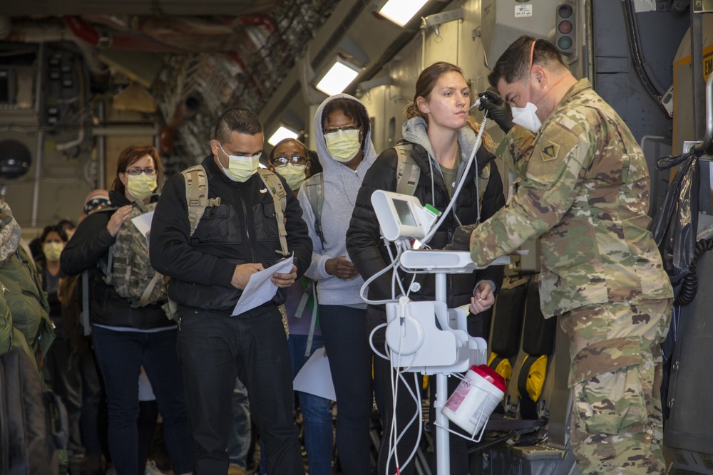 Massachusetts Army National Guard conducts medical screening.