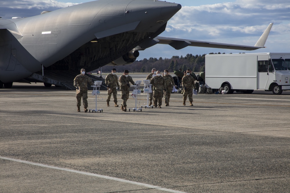 Members of The 801st Combat Support Hospital, U.S. Army Reserve, Fort Sheridan, Illinois, arrives in Hanscom Air Force Base