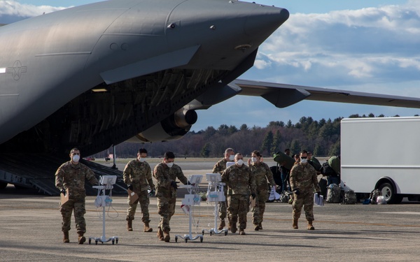 Members of The 801st Combat Support Hospital, U.S. Army Reserve, Fort Sheridan, Illinois, arrives in Hanscom Air Force Base