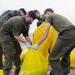 U.S. Marines assist with spill cleanup at Marine Corps Air Station Futenma