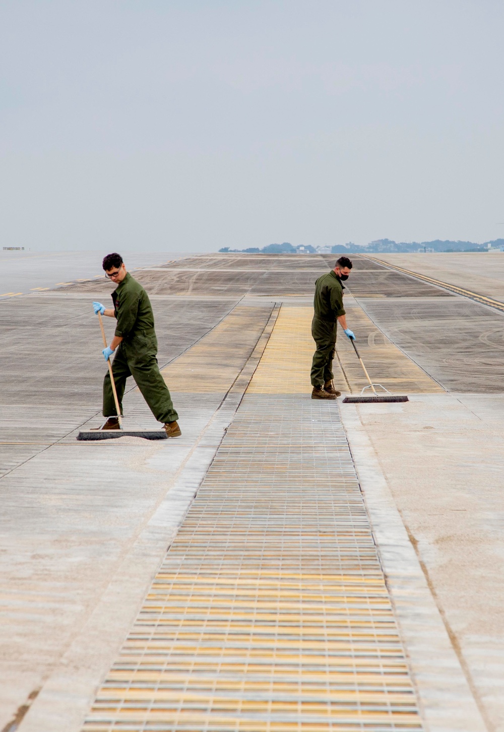 U.S. Marines assist with spill cleanup at Marine Corps Air Station Futenma