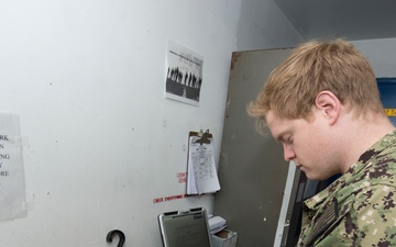 PR2 Spindler Inspects Aircrew Survival Gear