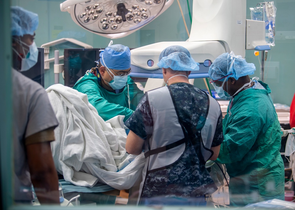 USNS Mercy Sailors Treat Patient